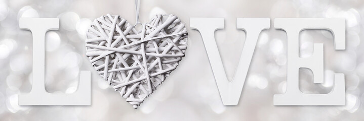 love text with heart of woven wood