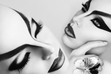 Black and White Portrait of Beautiful Model with Fantasy Creative Art MakeUp. White Background. Close Up