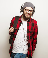  young bearded man listening to music