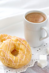 Donuts with cream and coffee