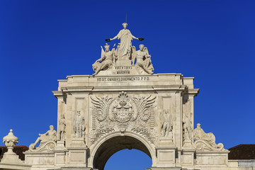 Arco da Rua Augusta with statues and blue sky