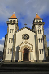 Church of Nossa Senhora da Alegria in Furnas with cloudy blue sk