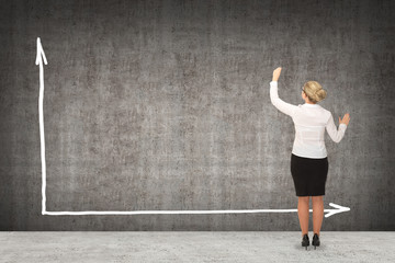 Business woman drawing on the wall. business concept
