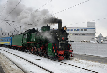 Fototapeta na wymiar Retro steam train at the station, Kiev, Ukraine