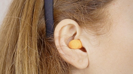 Ear plugs woman detail
