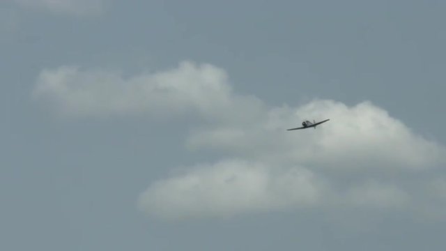 Aluminum clad T-6 Harvard trainer (also known as a Texan) in flight.  Used by Canada and the United States for pilot training.  Recorded in 4K, ultra high definition.
