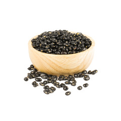 Seed black beans in wood cup isolated on white