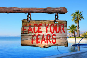 Face your fears motivational phrase sign