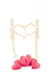 couple in love forming a heart with her arms