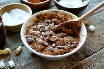 Preparing dough for chocolate pie on table close up