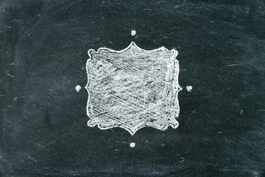 Hand Drawing Chalk Frame On Blackboard