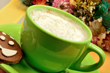 Cup of cappuccino on table