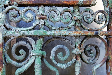 Old rusty forged fence, close up