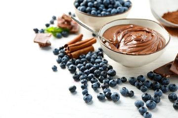 Beautiful composition with chocolate cream and blueberries