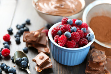 Beautiful composition with chocolate cream and ripe berries