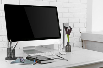 Stylish workplace with computer in home or office