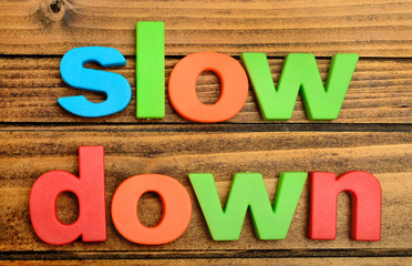 Slow Down word on table
