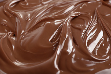 Background of melted milk chocolate, close-up