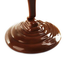 Melted milky brown chocolate pouring, isolated on white