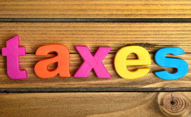 Taxes word on table