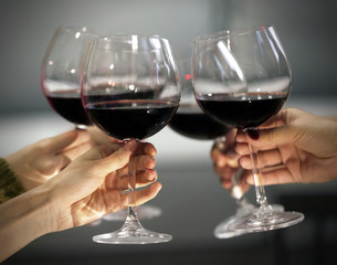 Glasses of red wine on a cheerful holiday