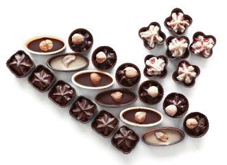 Composition of chocolate candies on white background