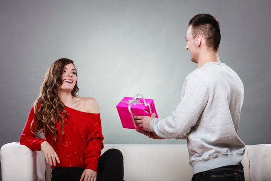 happy romantic couple with gift