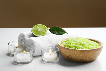 Relaxing spa set on white table against grey background
