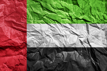 United Arab Emirates flag painted on crumpled paper background