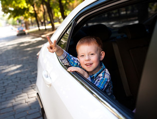 Adorable baby boy in the car