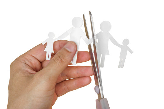 Scissors cutting paper cut of family / Broken family concept / divorce