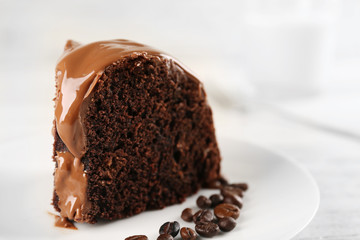 Piece of chocolate cake on a table, closeup