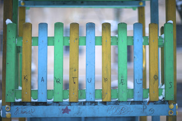 Closeup of colored wooden fence's panels