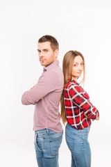 Couple in love  standing back to back with crossed hands