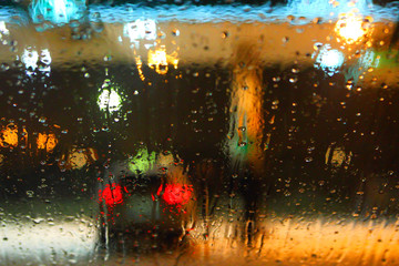 Rain drops on glass. Abstract background. Gas station of gasoline.