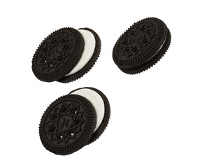 Close up isolated black cookies like oreo against hite background, computer ggenerated image in high definition