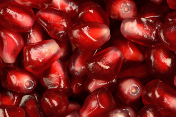 ripe pomegranate grains background