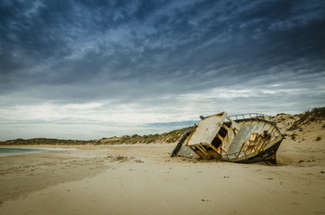 Fishing boat wrecking on the beach