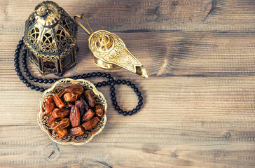 Ramadan lamp, rosary and dates. Holidays decoration - obrazy, fototapety, plakaty