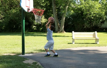 Young Boy Getting Ready to Throw a Basketball