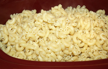 Casserole dish filled with cooked pasta noodles
