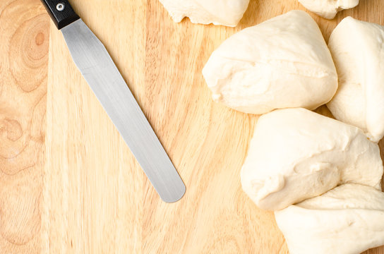 Bread cooking,bread  dough and spectula on wooden background