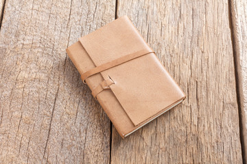 Brown Leather notebooks on wooden table
