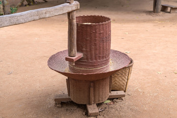 Naklejka premium Traditional of wooden rice milling machine in Thailand
