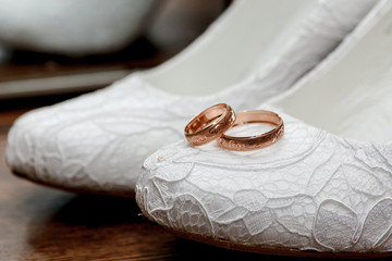 wedding ring on the bride's shoes.