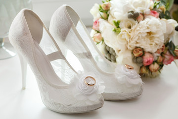 wedding ring on the bride's shoes.