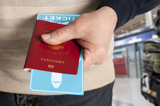 Passport and ticket in hand in airport