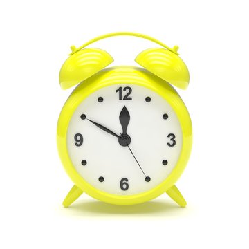 Yellow alarm clock on white