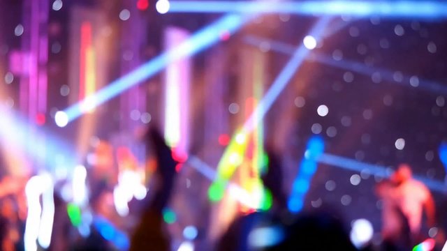 blurred focused concert crowd in hall