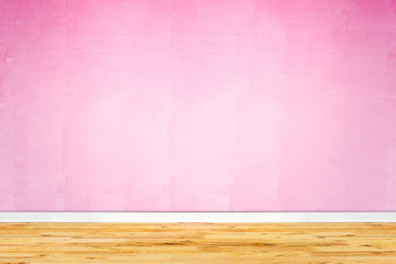 Wood floor with pink wall